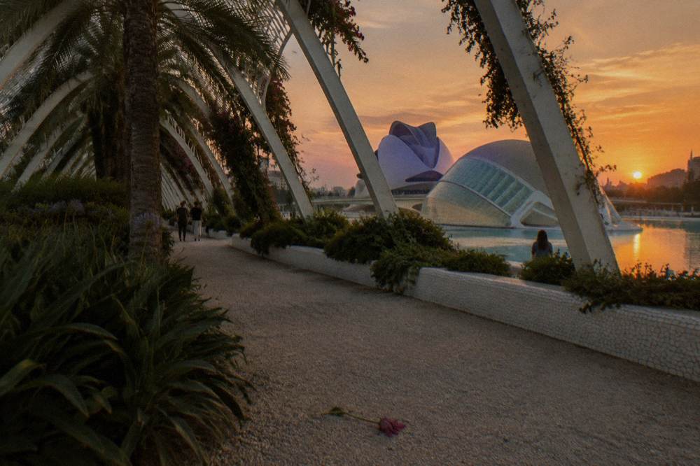 Dusk sky over the City Of Arts And Sciences with white buildings reflected in the surrounding pools