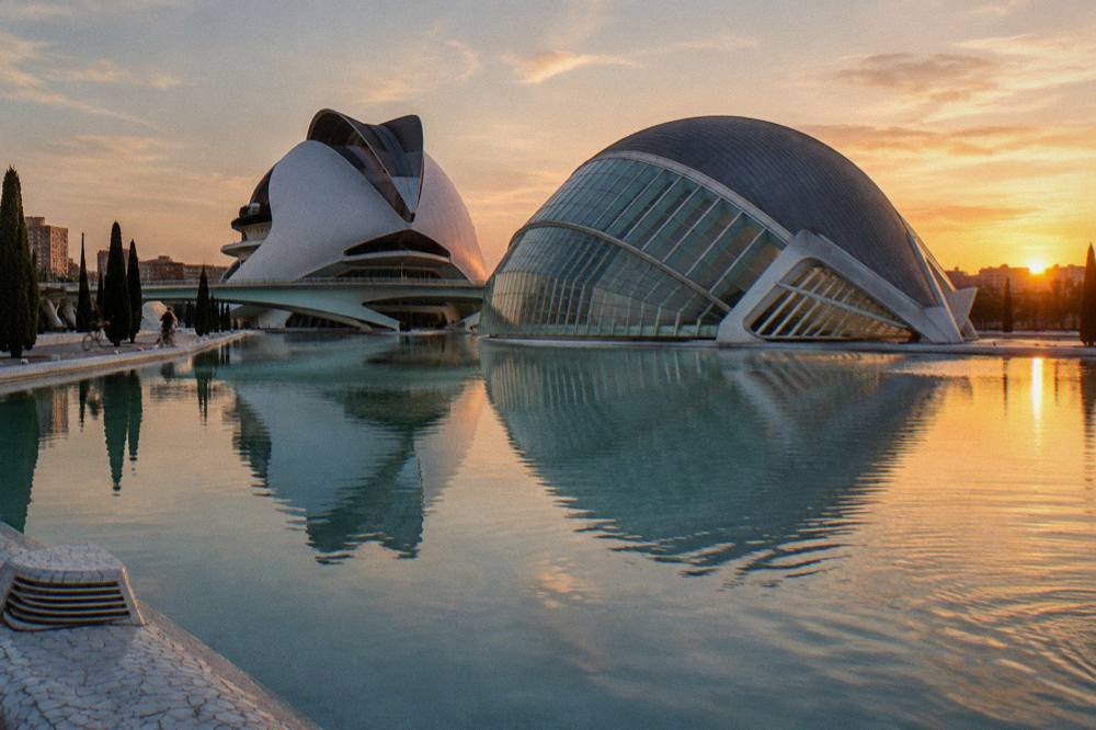White curved architecture of the complex seen across the wide water pools